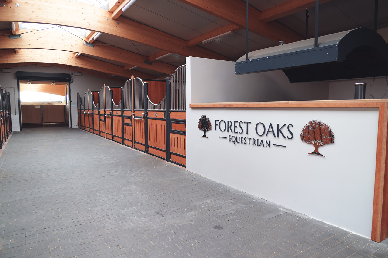 The stable barn walkway at Forest Oaks Equestrian in the New Forest